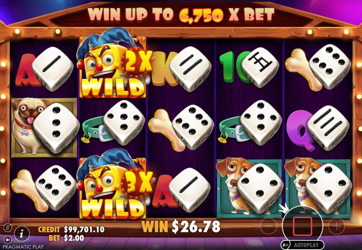 Free spins on the stage: a 2x and a 3x jester wild stuck on reel 2 between dice symbols, with the total win at $26.78.